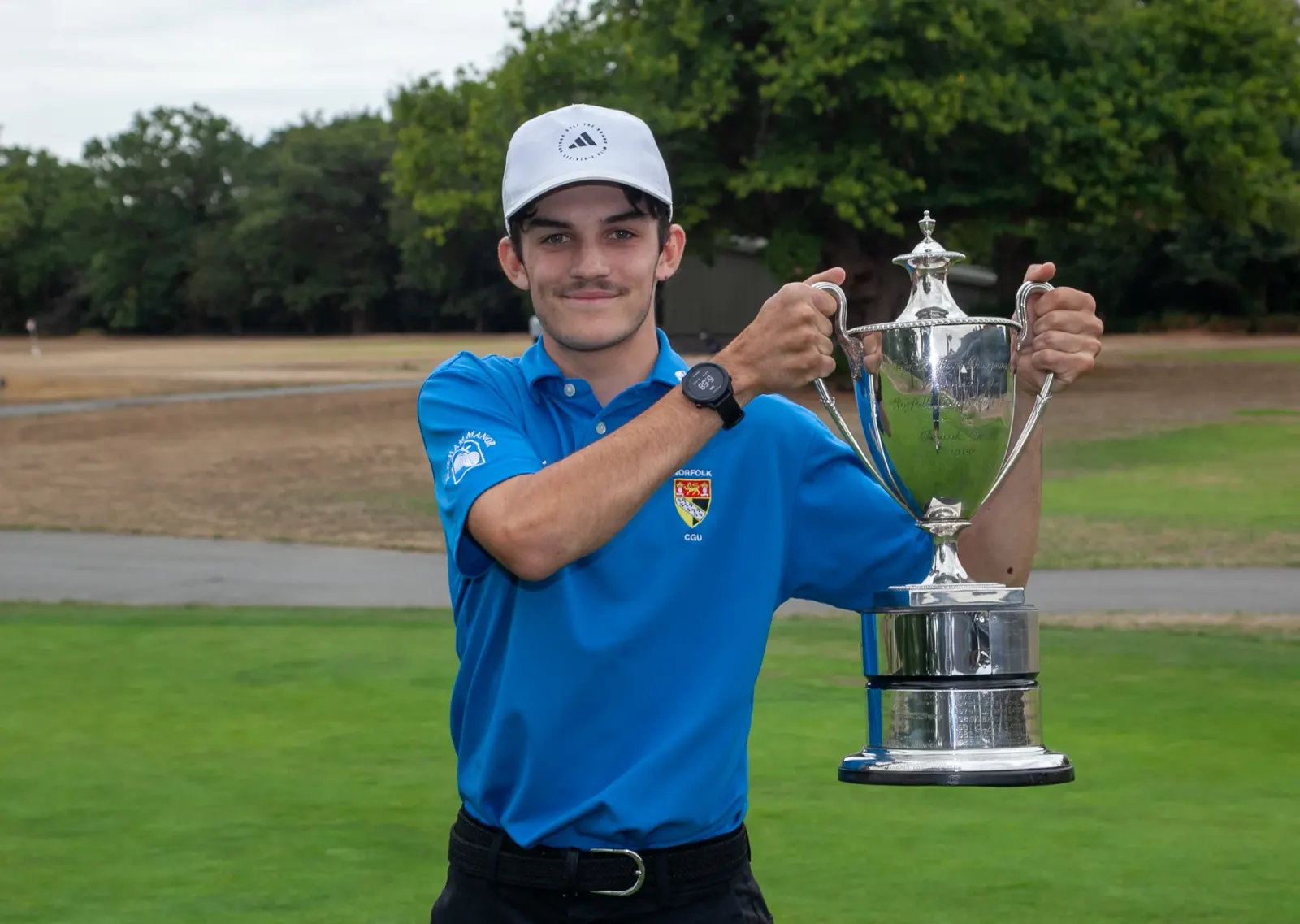 Liam Caffyn celebrates his two-shot success in the Norfolk Boys Championship